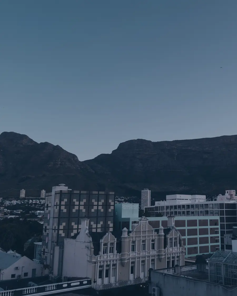 Cape Town heritage rooftops beneath the mountain at dusk